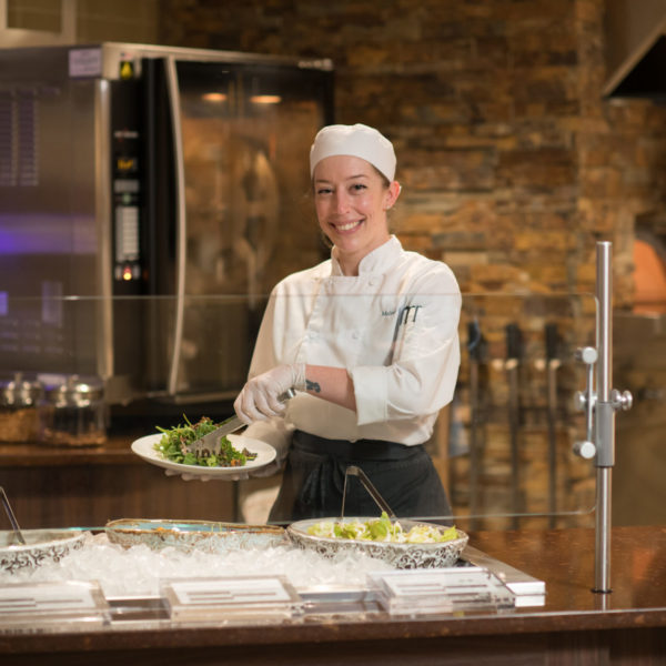 Chef serving salad